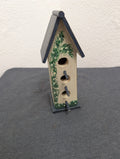 Vintage handcrafted three post tall birdhouse